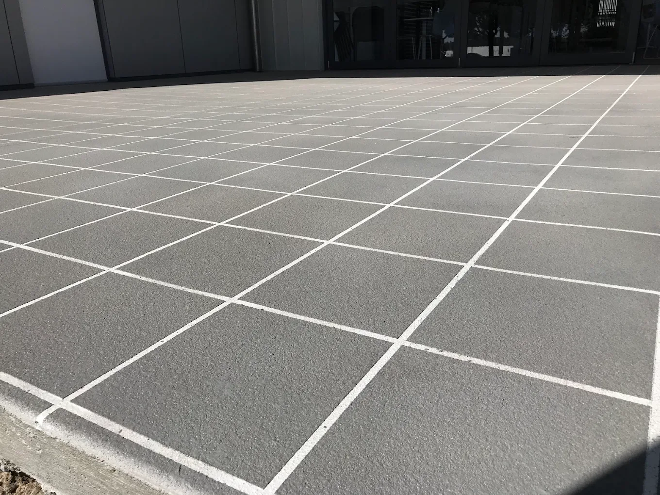 Stencil concrete pattern compared with laid paving
